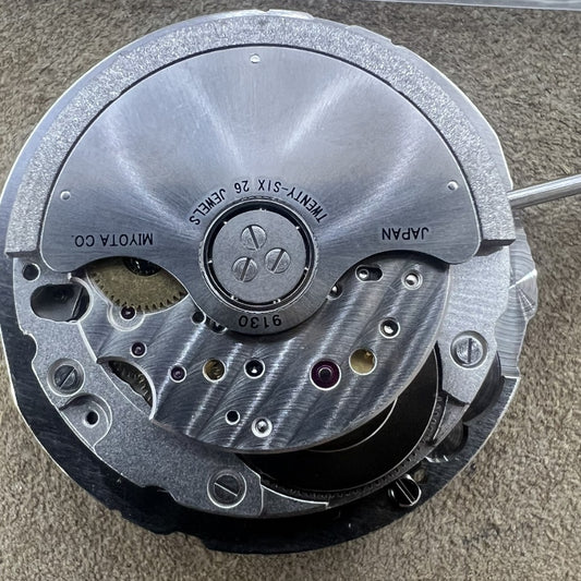 Miyota 9130 automatic mechanical watch movement with date display at 6 o'clock, precision engineering.
