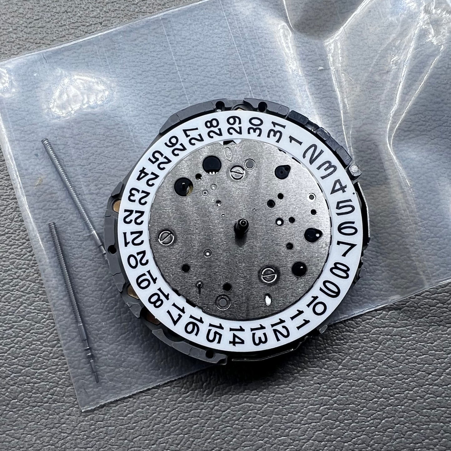 Japan Miyota JS26 watch quartz movement with date at 3 o'clock and small seconds at 6 and 9 markers
