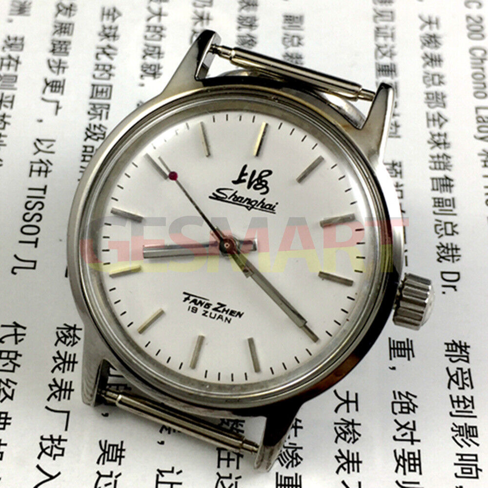 32mm Shanghai Factory manual mechanical watch with silver case and silver nail hands, classic style.