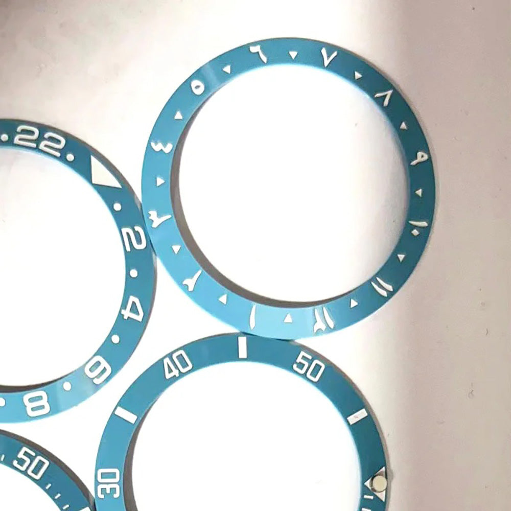 Blue ceramic bezel insert with white Arabic numerals for SUB GMT 38mm diver watch.