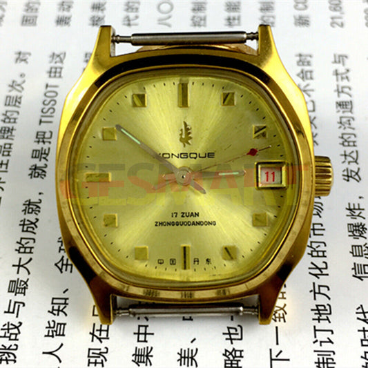 Old Stock Dandong manual mechanical watch with 17 jewels, single calendar, and elegant golden dial.