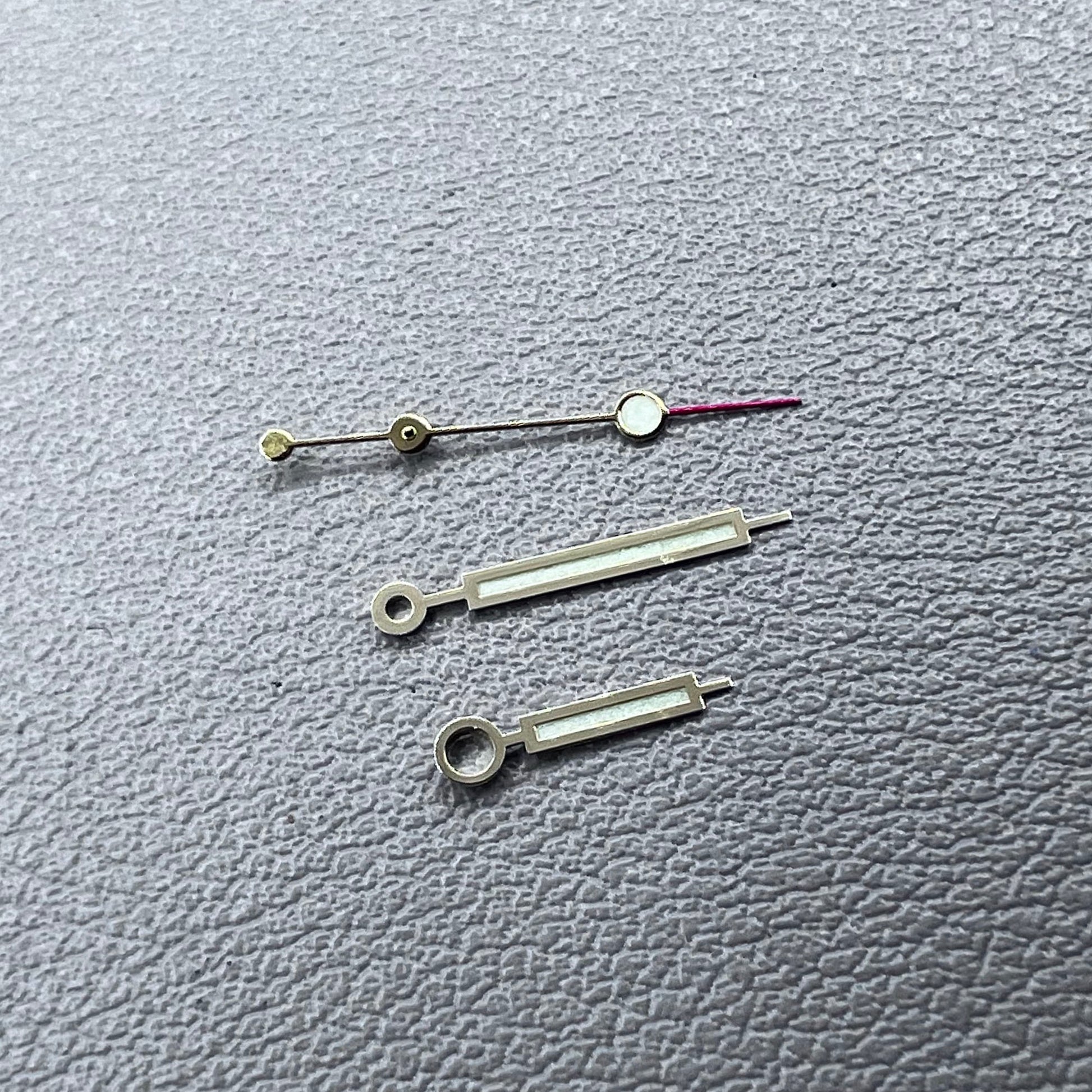 Green luminous watch hands with golden trim for NH35 NH36 movements, enhancing visibility and style.