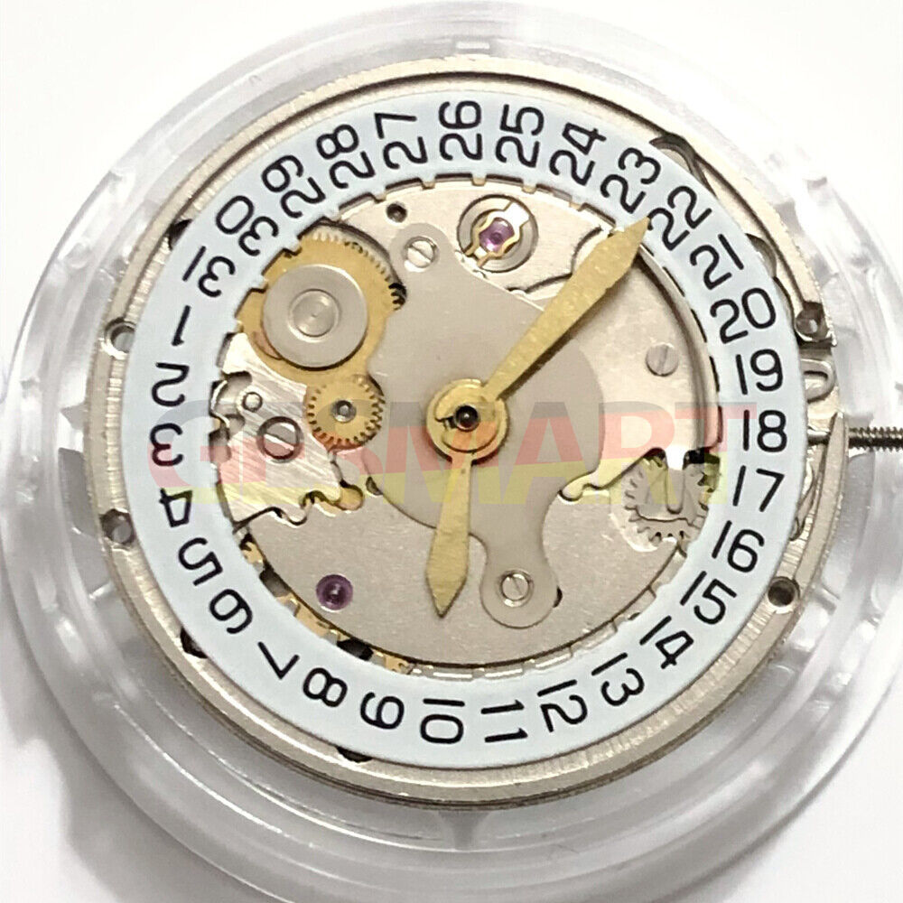 Shanghai 2824 automatic watch movement with silver carved design and date display at 3 o'clock.