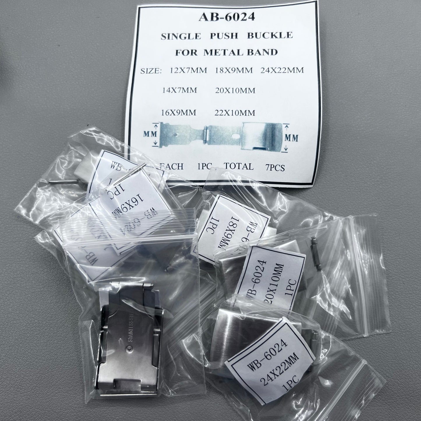 Seven sizes of Metan single push watch buckles for secure watch band fastening.