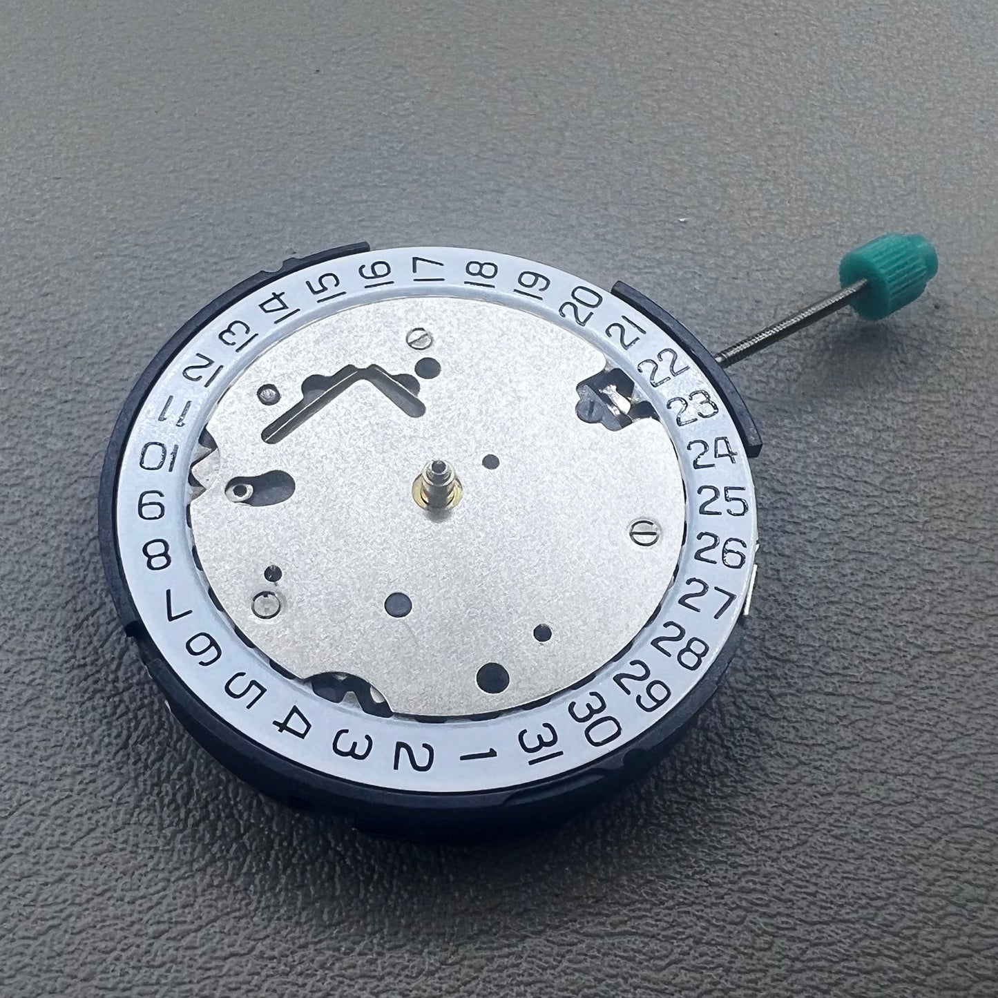 Swiss ISA 8371C quartz movement by ISA, multifunctional watch mechanism for precise timekeeping.