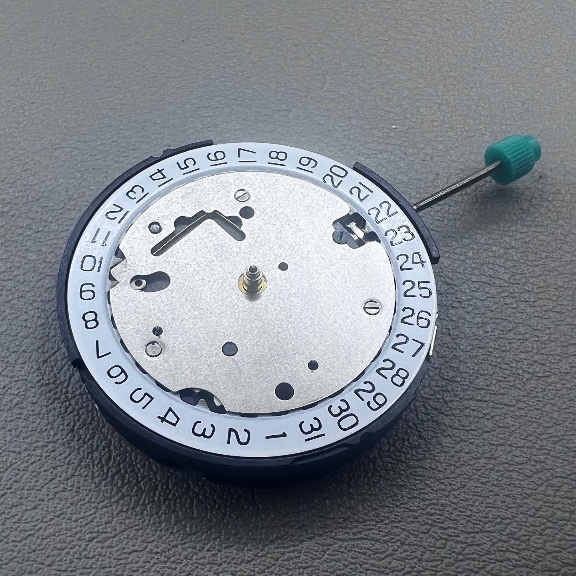 Swiss ISA 8371C quartz movement by ISA, multifunctional watch mechanism for precise timekeeping.
