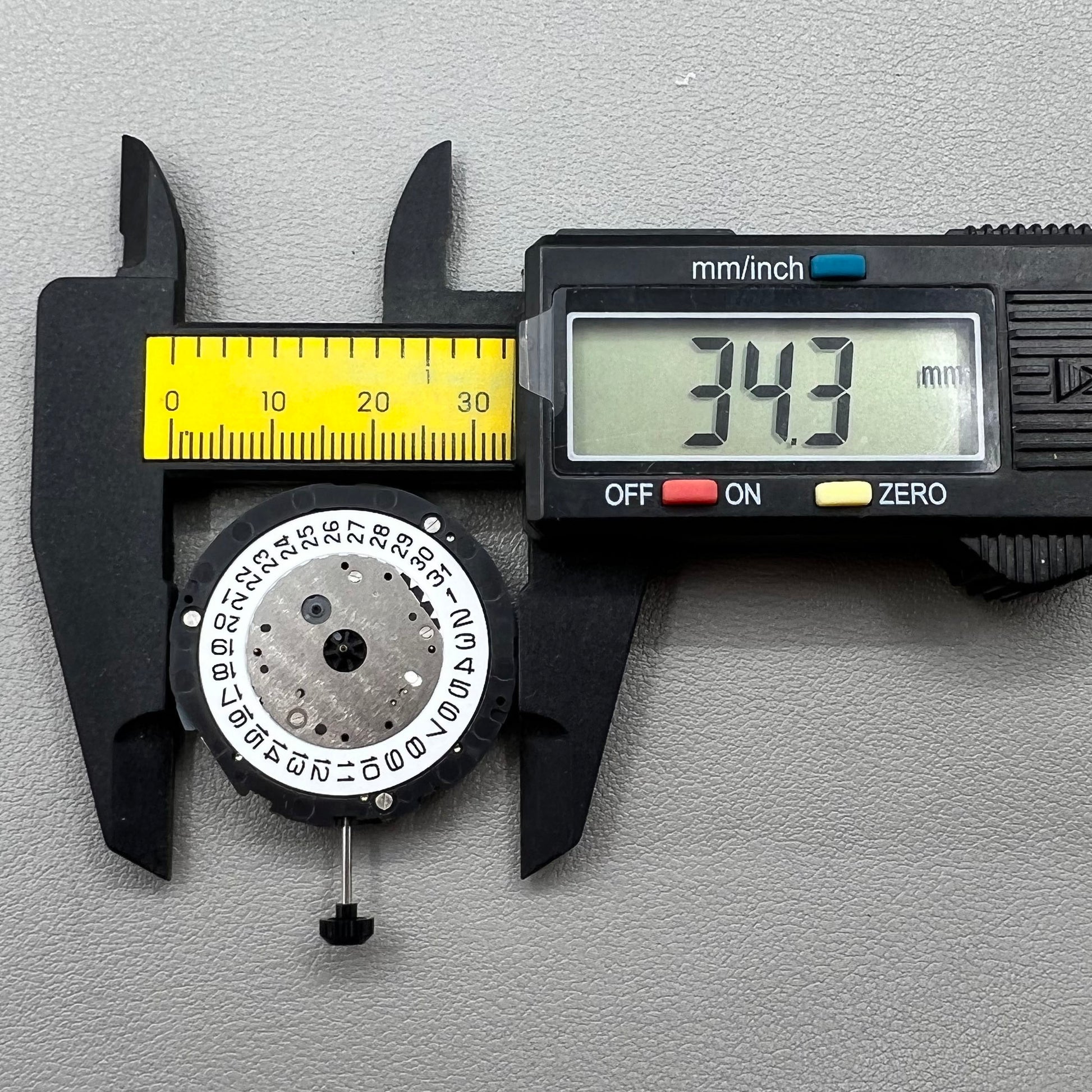 Japan Miyota 6S11 quartz watch movement featuring 2 hands, date at 3, small seconds at 6 and 12 positions.