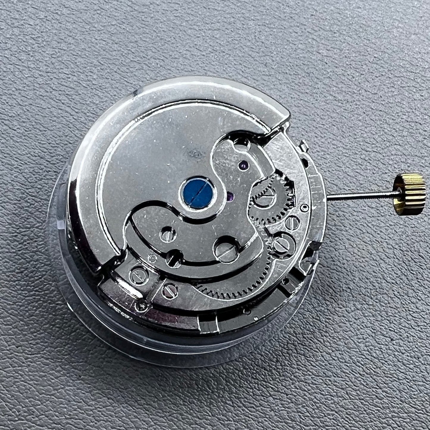 Silver Asian Dandong automatic watch with mechanical movement, date and week indicators, moon phase display.