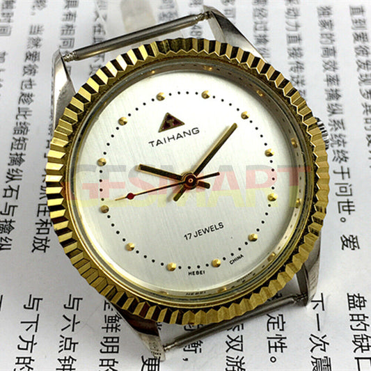TAIHANG 38mm manual mechanical watch with silver dial, round case, and 3 hands, featuring 17 jewels for precision.