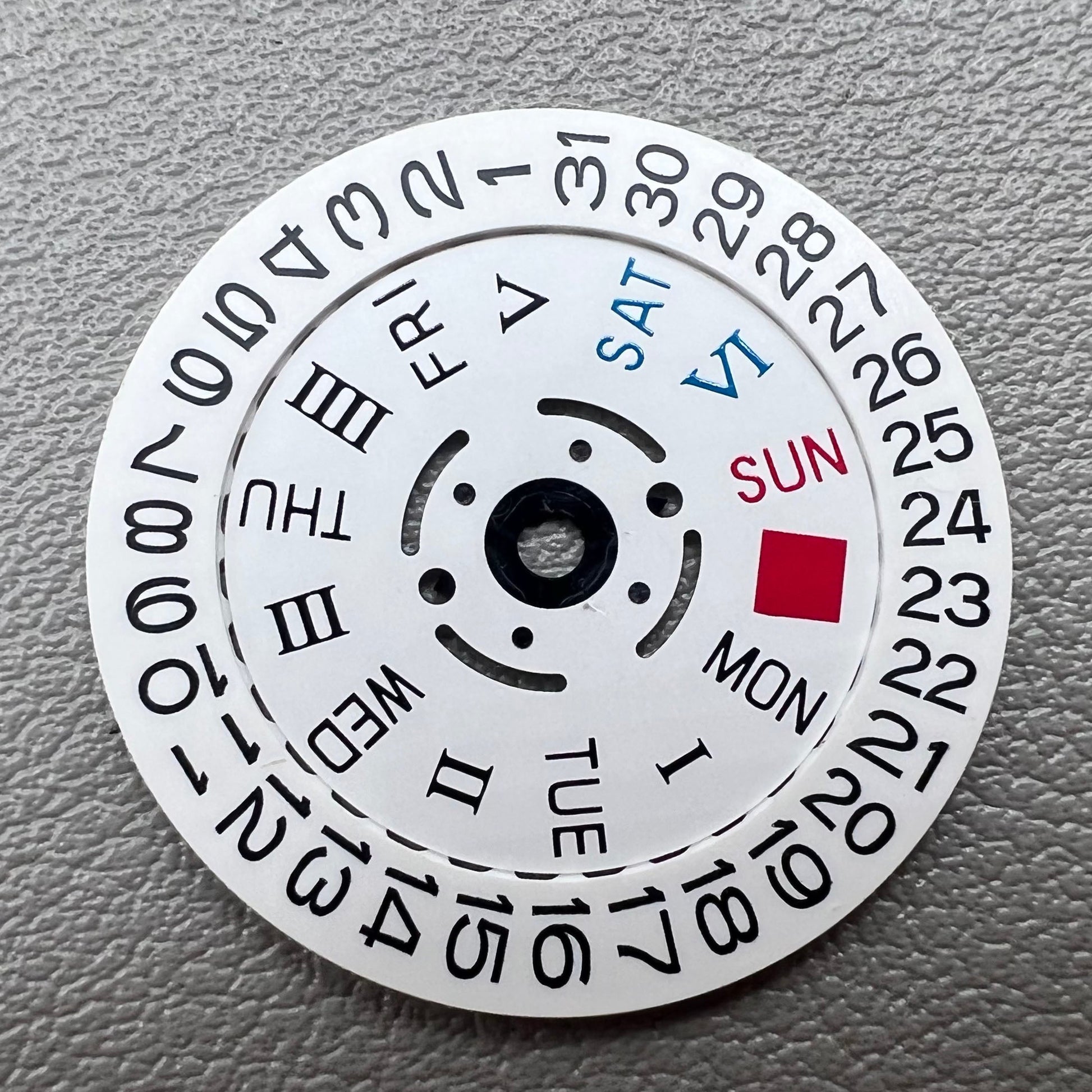White date display with Roman and English weekday wheel for NH36 movement, crown at 3 o'clock.