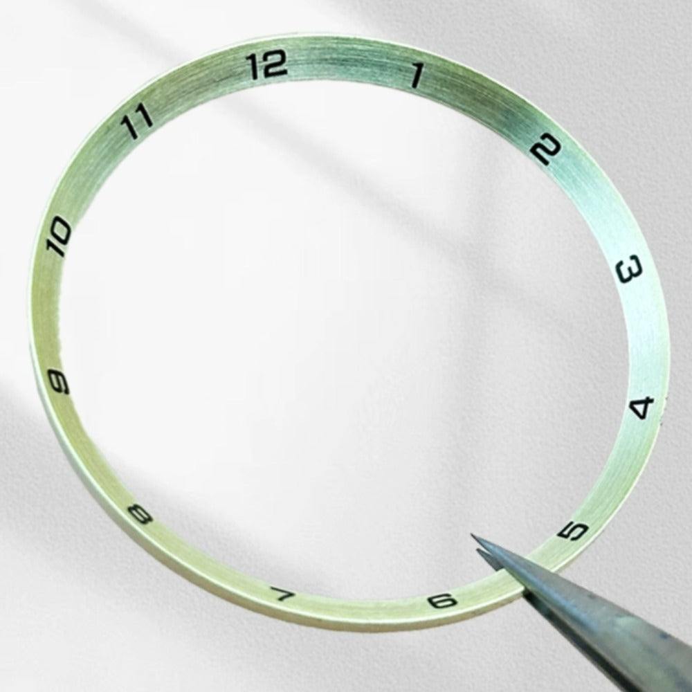 Golden stainless steel chapter ring, 34.9x31.0mm, for precise watch repair parts.