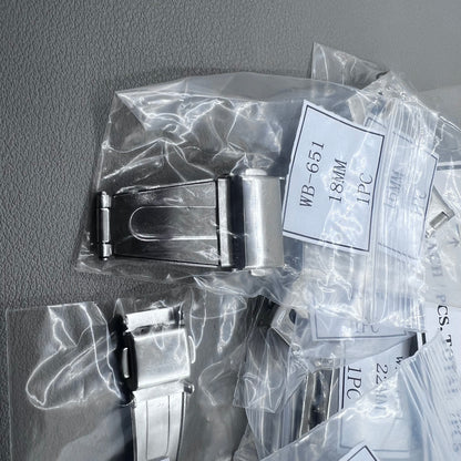 Set of 7 silver stainless steel watch buckles, 10-22mm, polished double-sided for secure clicks.