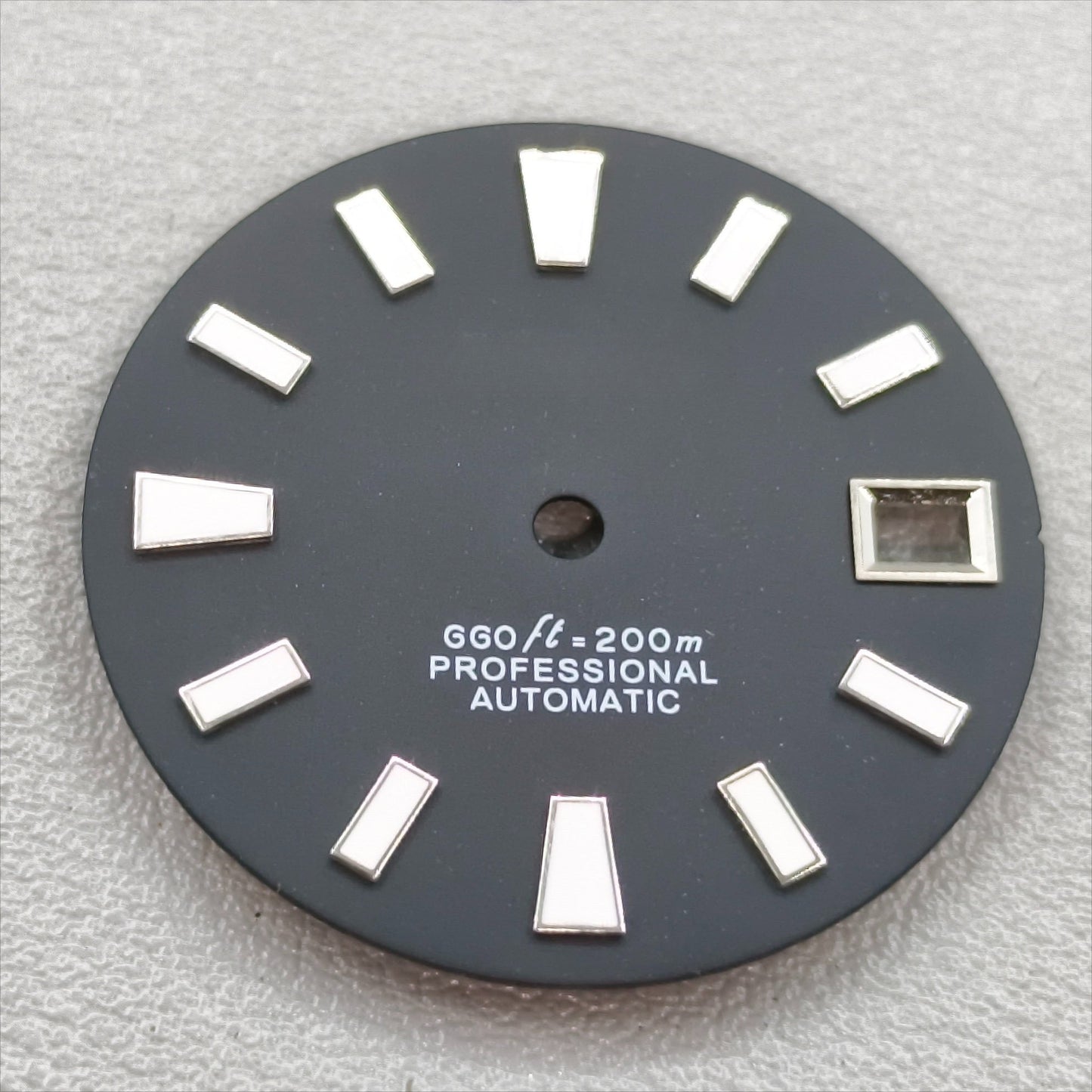 watch dial with S logo