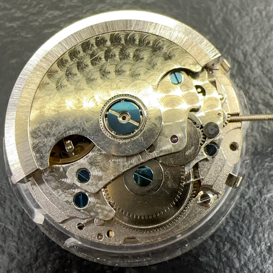 China-made watch accessory featuring multifunctional mechanical movement, moon phase at 6, week disk at 12.