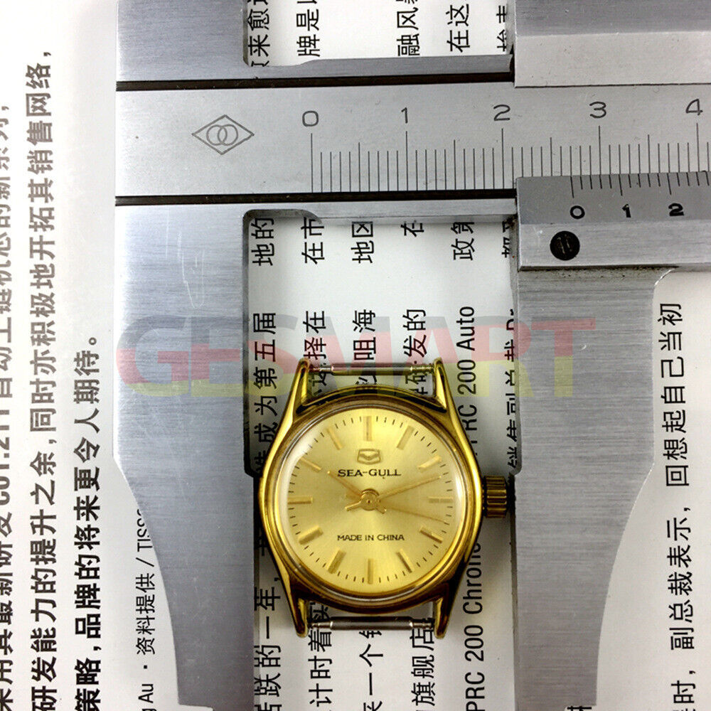 27mm Tianjin Seagull ladies watch with golden nail bezel and manual mechanical movement, elegant accessory for daily wear.