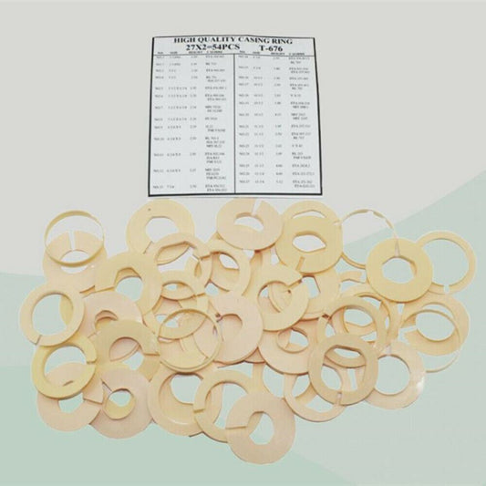 Set of 54 ivory watch movement casing rings for repairs, multiple sizes for precision fit.