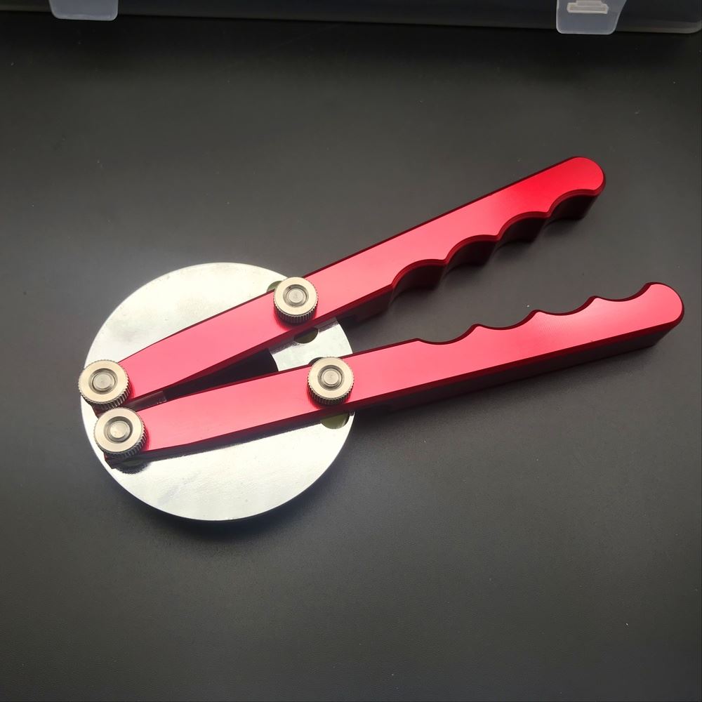 Watch bezel remover plier for rotating bezels by RLX, ideal for precise watch repair tasks.