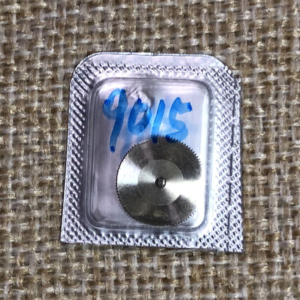 Complete barrel with mainspring for Miyota 9015 movement, generic fit replacement part for watch repair.