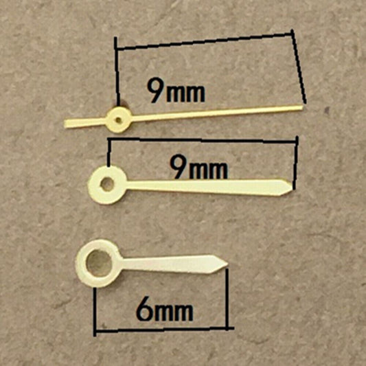 Polished golden arrow watch hands for Ronda 763 quartz movement, ideal for elegant repairs.