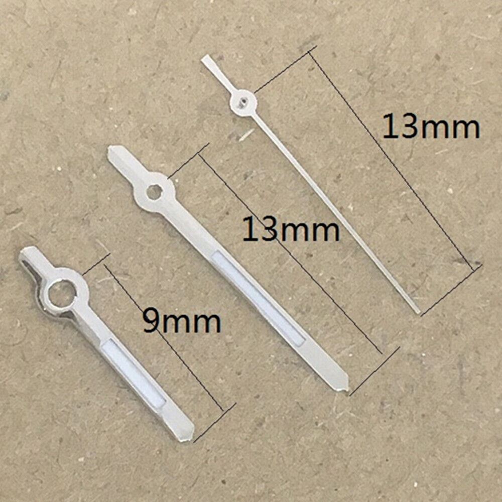 13mm silver-trimmed green lume watch hands by Hattori for Epson PC32 quartz movement timepieces.