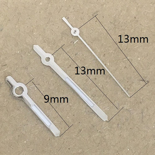 13mm silver-trimmed green lume watch hands by Hattori for Epson PC32 quartz movement timepieces.