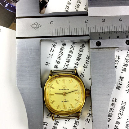 Golden dial ladies watch by Seagull, 19 jewels manual mechanical movement, elegant Tianjin China design.