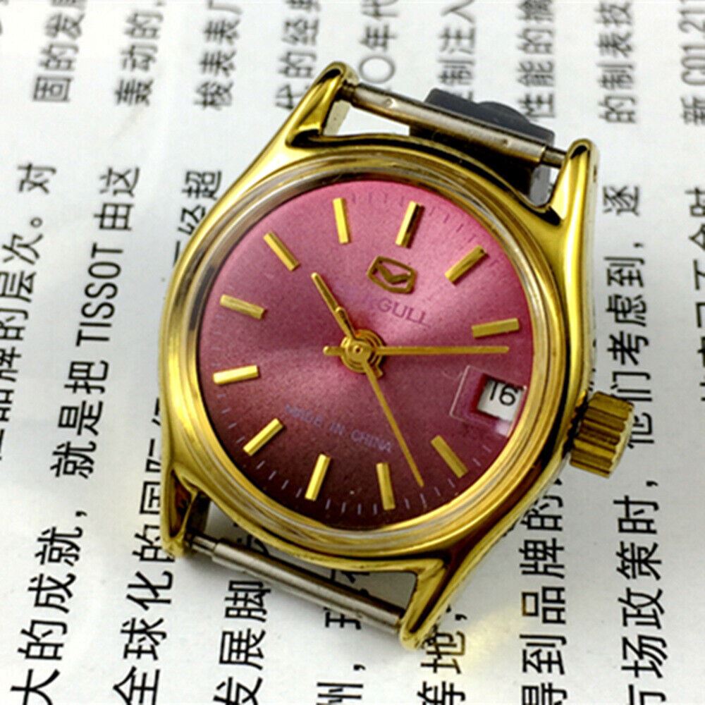 Purple dial ladies watch by Tianjin Seagull, gold accents, manual mechanical movement, elegant accessory.
