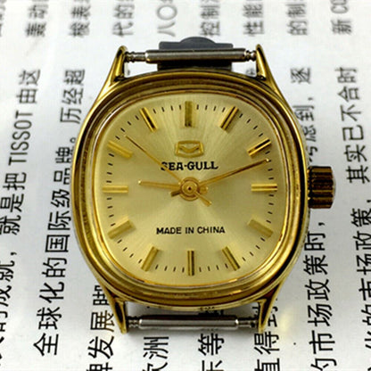 Golden dial ladies watch by Tianjin Seagull featuring manual mechanical movement and elegant design.
