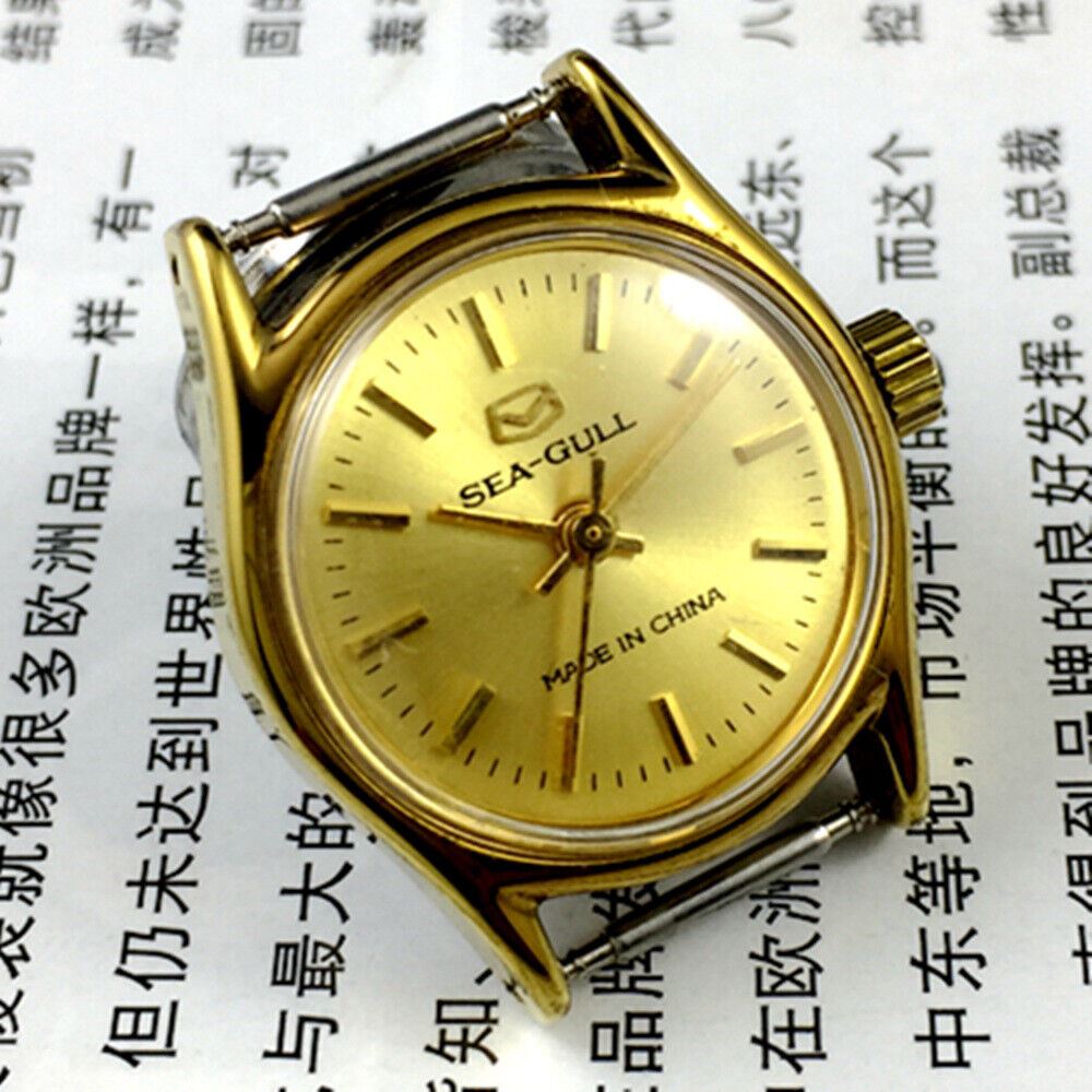 Round gold-tone case ladies watch with golden nail markers, manual mechanical movement by Tianjin Seagull.