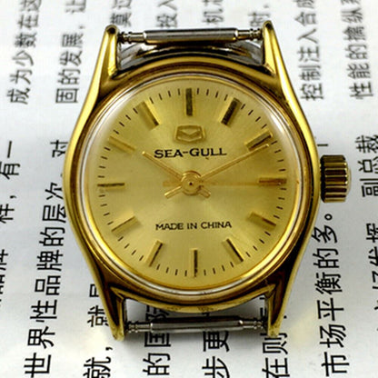 Round gold-tone case ladies watch with golden nail markers, manual mechanical movement by Tianjin Seagull.