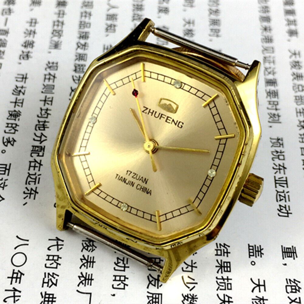 Octagonal golden dial Tianjin Factory manual watch with leather strap, classic collector?s timepiece.