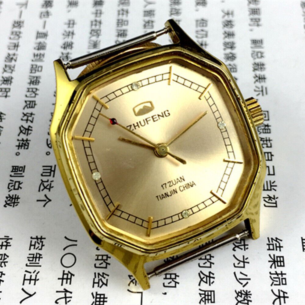 Octagonal golden dial Tianjin Factory mechanical watch with leather strap, classic collector's timepiece.