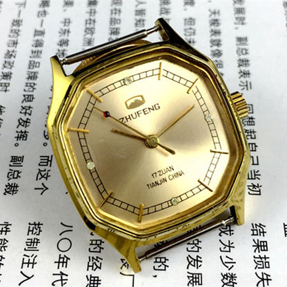 Octagonal golden dial Tianjin Factory mechanical watch with leather strap, classic collector's timepiece.