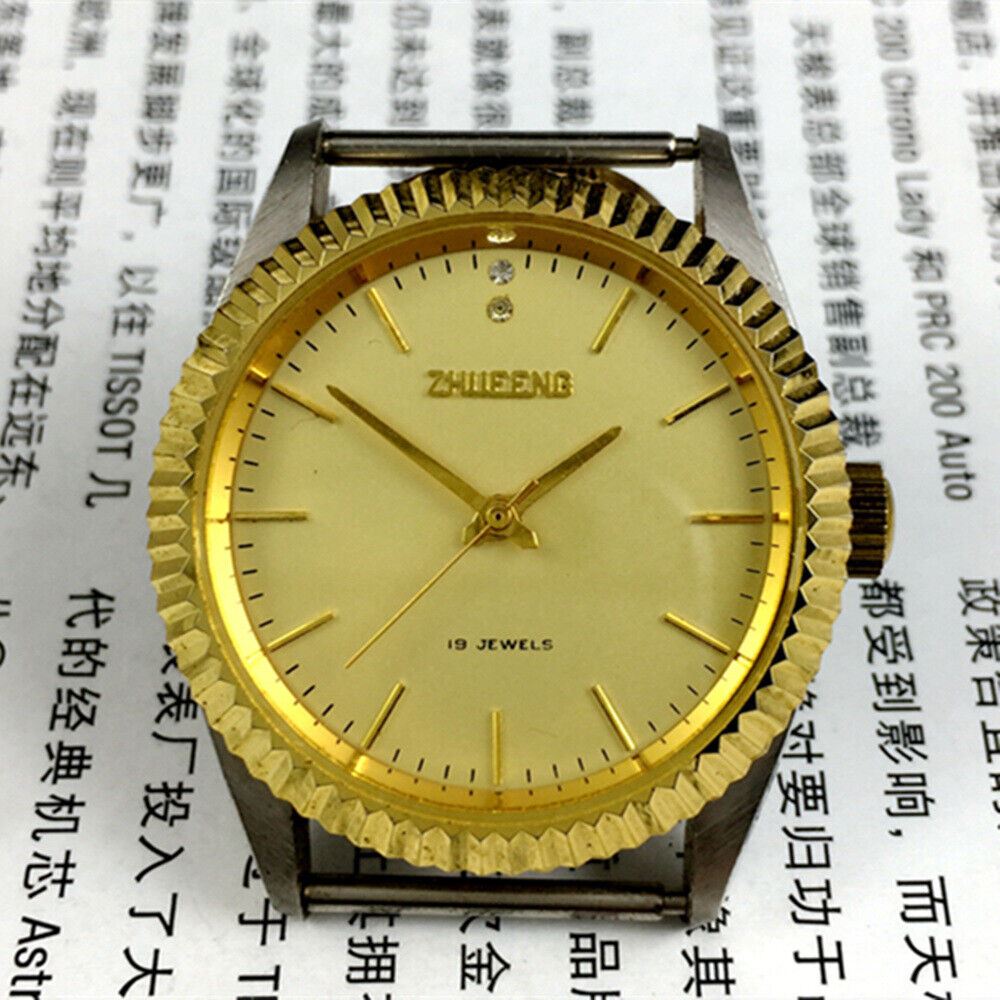 Tianjin Factory manual mechanical watch with round golden dial, classic design, and precise craftsmanship.