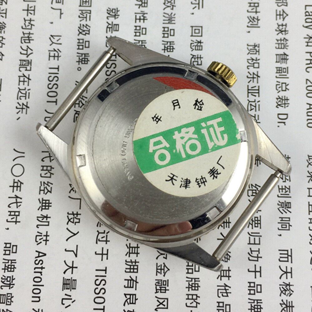 Tianjin Factory round golden dial mechanical watch, classic design and precise craftsmanship for elegant style.