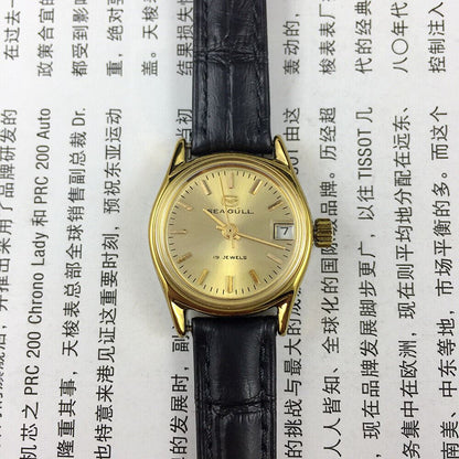 Golden dial Seagull Lady Watch with 19 jewels, manual mechanical movement, elegant design by Tianjin Factory.