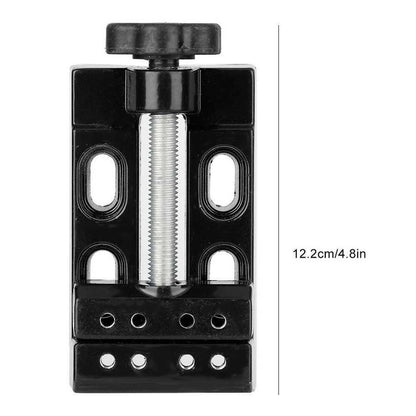 Mini electric drill with flat vice and clip opening table clamp for precise jewelry work.