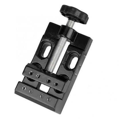 Mini electric drill with flat vice and clip-opening table clamp for detailed jewelry crafting.
