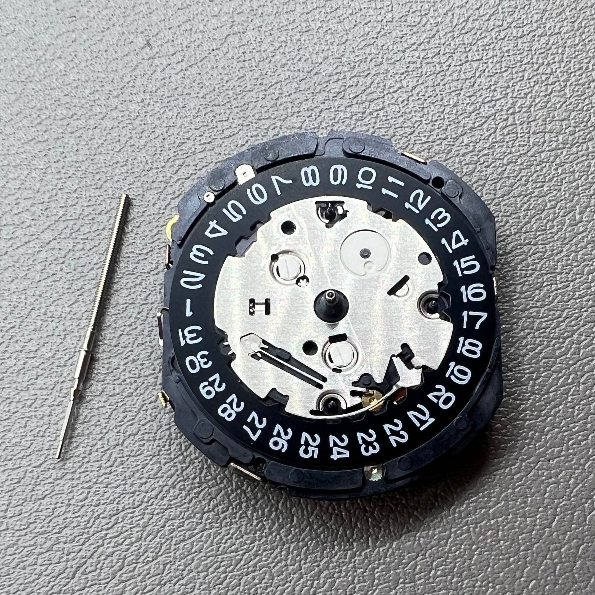 Seiko 7T85A quartz watch movement, precise craftsmanship made in Japan for reliability.
