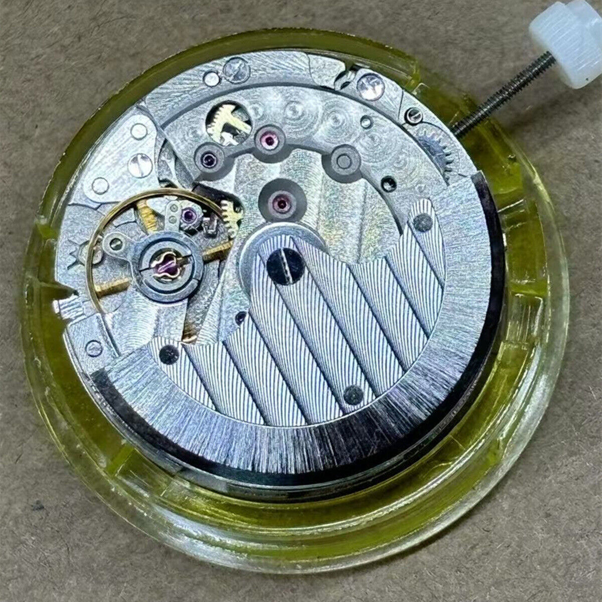 Mingzhu 2813 automatic watch movement featuring moon star phase at 6 o'clock with precise detailing.