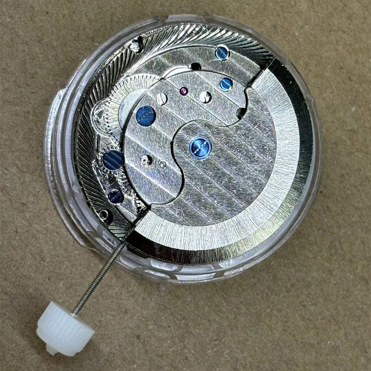 Shanghai watch accessory featuring automatic mechanical movement, big date at 12, and bare flywheel design.