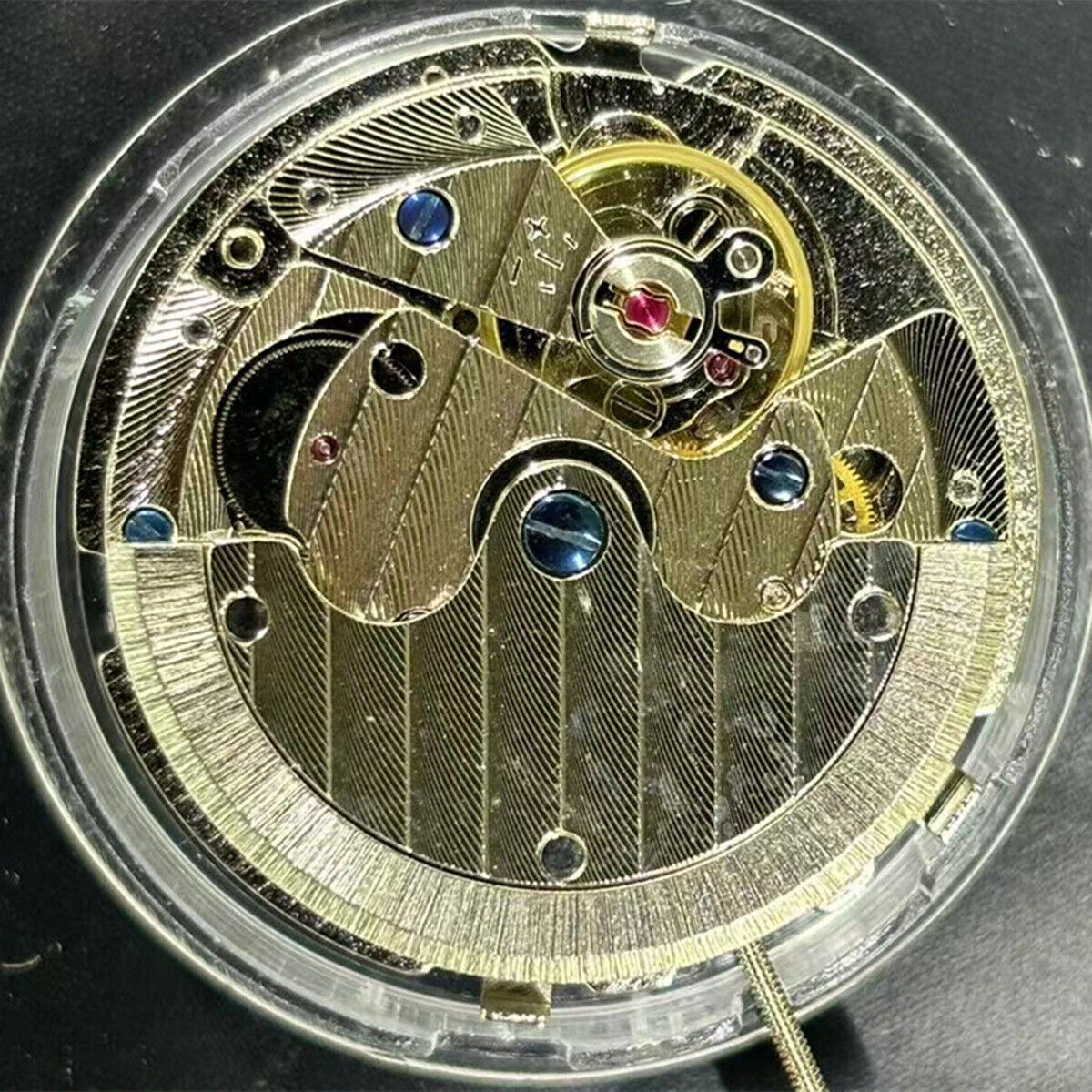 China Made TY2876 watch movement showing automatic mechanical design with small second markers at 3, 6, 9, and 12 positions.