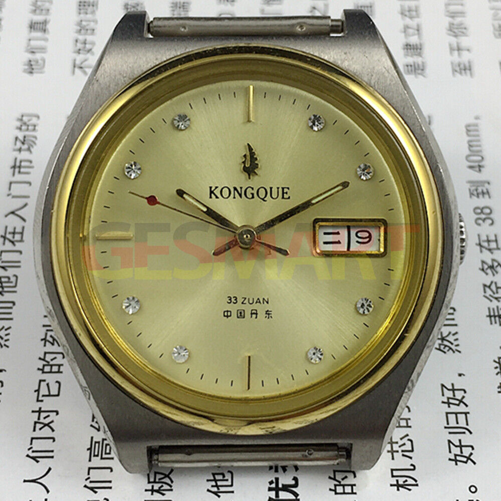 38mm China Made automatic watch with 17 jewels, double calendar, and golden dial.