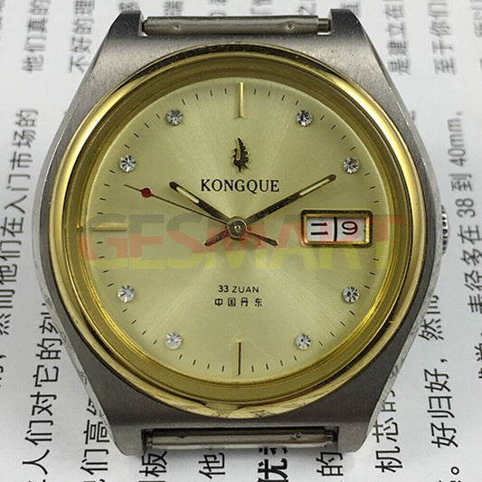 38mm China Made automatic watch with 17 jewels, double calendar, and golden dial.
