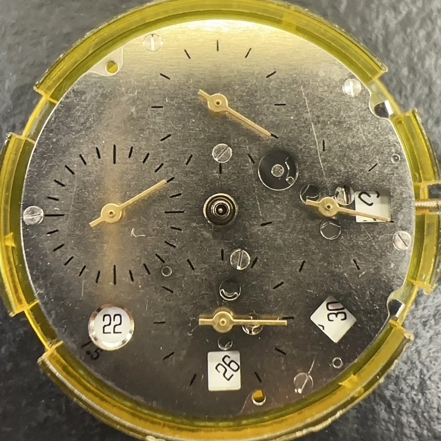 Mingzhu watch accessory showing mechanical movement with single calendar date at 7.5 and small second subdials at 3, 6, 9, and 12 positions.