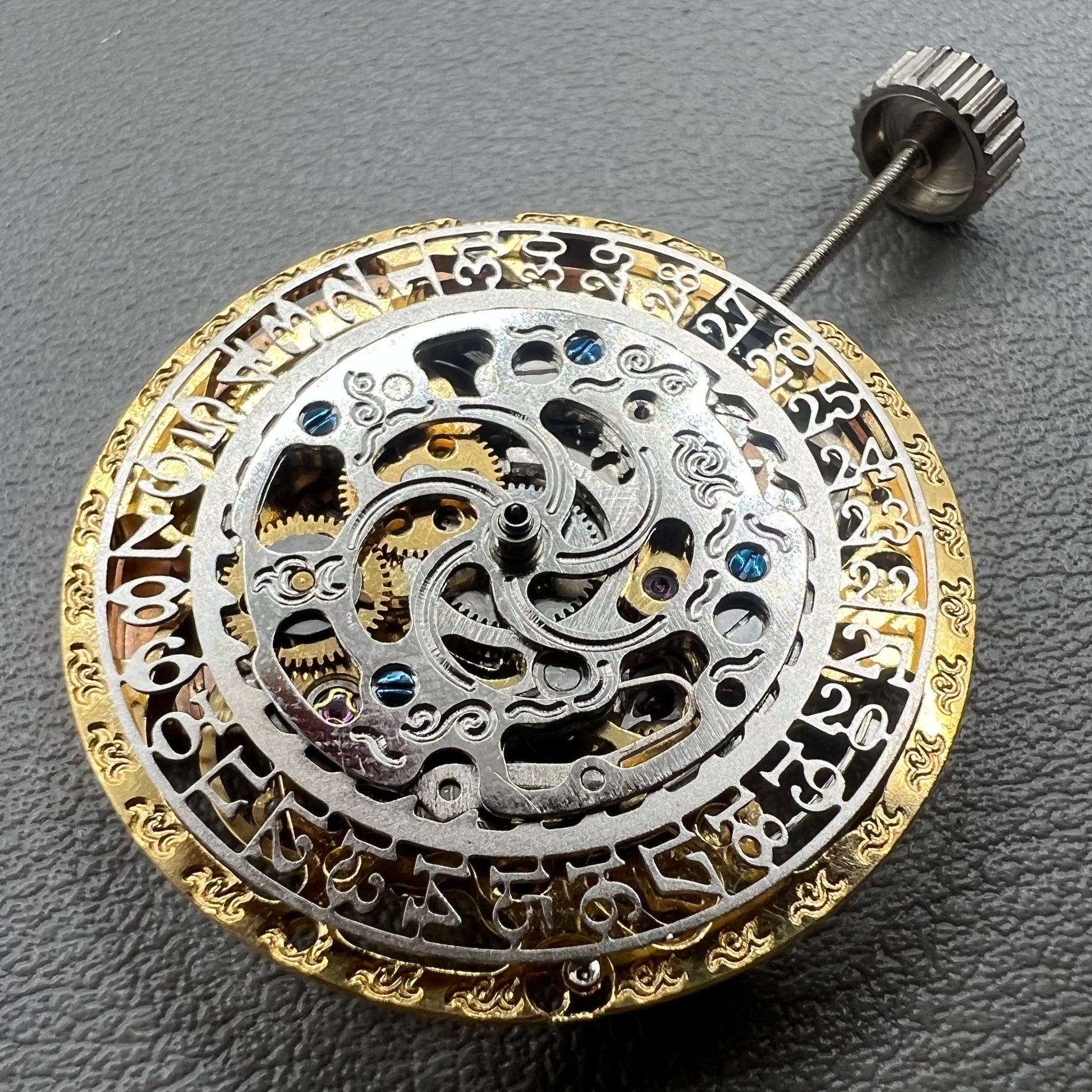 Golden Hangzhou 2189 mechanical calendar watch movement showcasing intricate hollow design and precise craftsmanship.