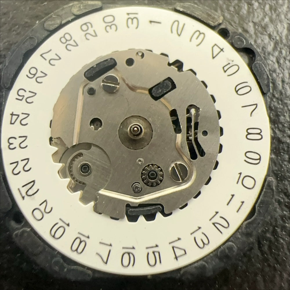 Japan Made VX39 quartz watch movement showing 3 hands and single calendar date at 3 o'clock position.