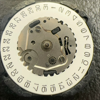 Japan Made VX39 quartz watch movement showing 3 hands and single calendar date at 3 o'clock position.