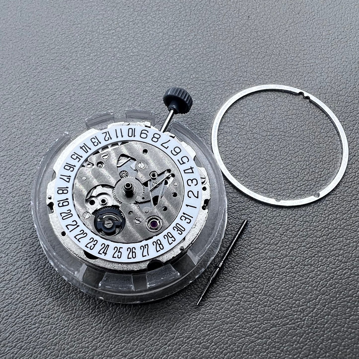 Japan Miyota 8215 silver plated automatic watch movement with date at 6 o?clock, precise mechanical design.