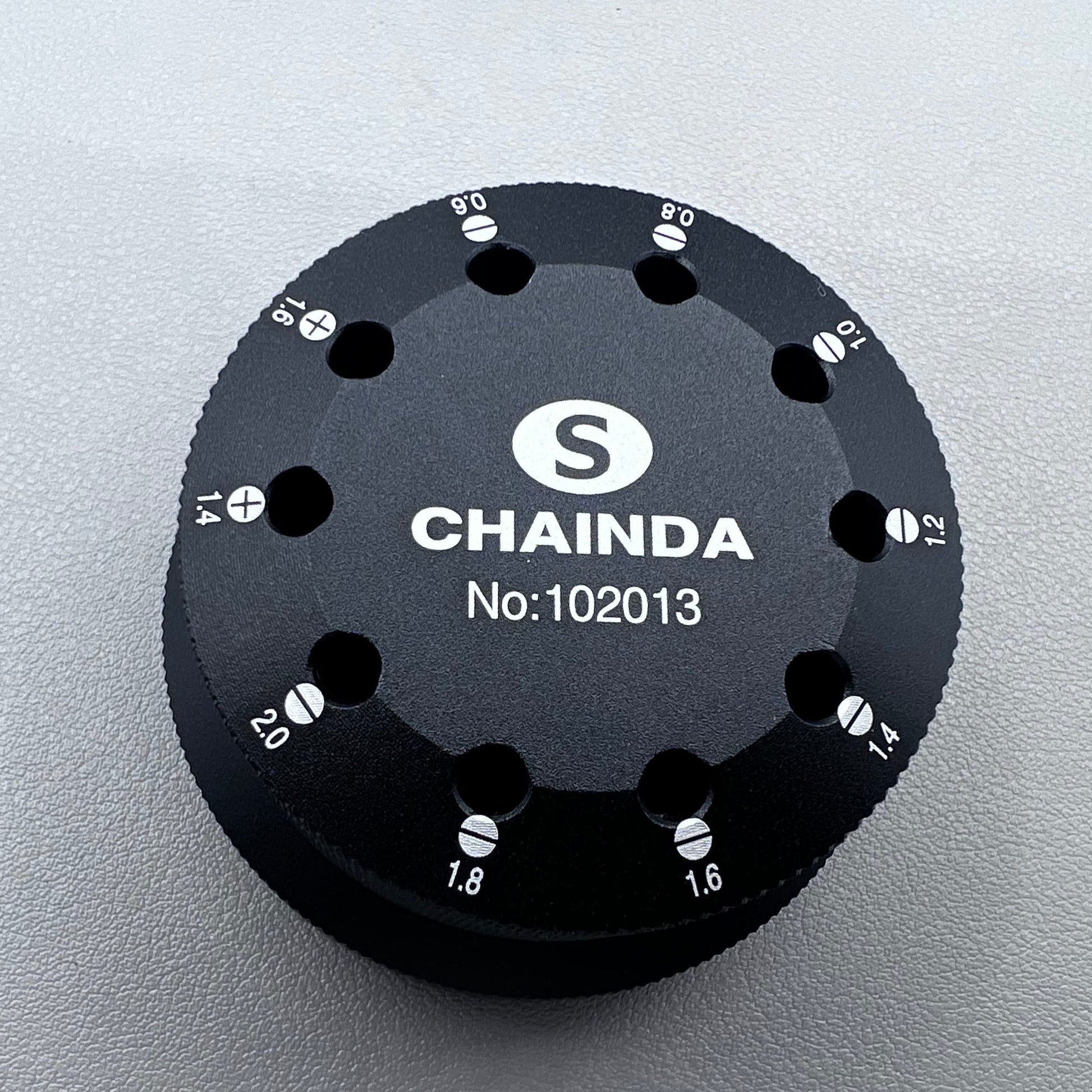 Black rotating stand with 10 slots for 0.6-2.0mm watch screwdrivers, organized storage solution.